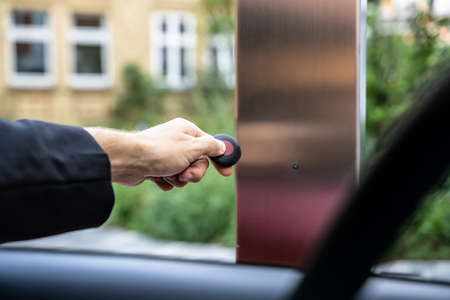 Automatic Wireless Home Garage Door. Hand Using Controller In Car