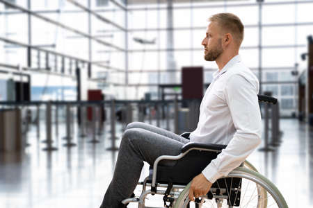 Disabled Adult People Travel In Wheelchair At Airportの写真素材