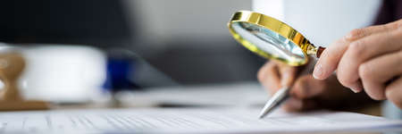 Businesswoman Investigation Finance Using Magnifying Glass. Fraud And Auditの写真素材