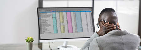 Neck Pain Bad Posture Stress At Computer In Officeの写真素材