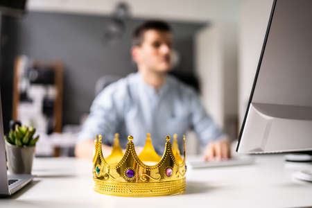 Manager Boss Man Wearing King Crown In Officeの写真素材