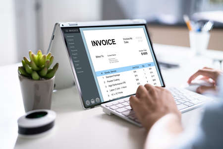 E Invoice On Laptop. Online Electronic Bill Managementの写真素材