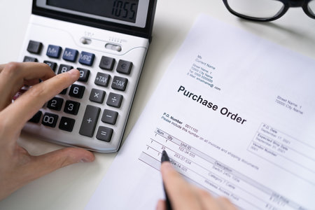 Person Hand Filling A Purchase Order Form On Deskの写真素材