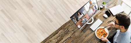 Virtual Lunch Party Conference On Computer In Officeの写真素材