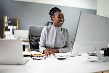 African Woman In Virtual Video Conference Call On Computerの写真素材
