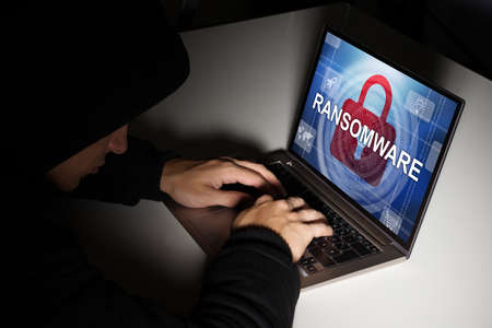 Ransomware Virus. Ransom Extortion Attack. Hacked Encrypted Laptopの写真素材