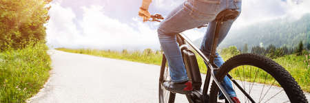 Man Riding Electric Mountain Bike In Alps