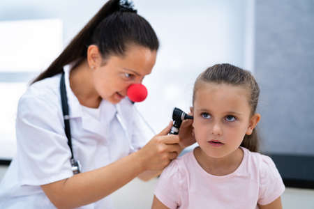Otolaryngology Infection. Child Doctor Checking Ear Using Otoscopeの写真素材