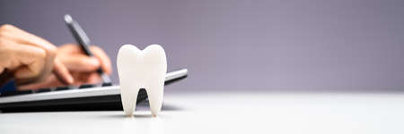 Dental Money And Dentist Cost. Tooth Implant Insurance