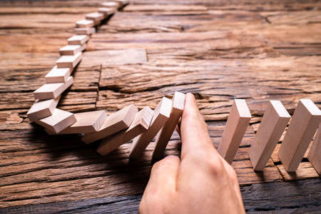 Domino Fall Prevention And Stop Using Handの写真素材