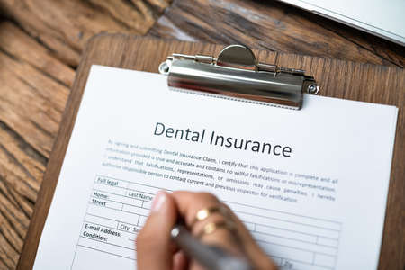 Dental Insurance Form On Desk. Dentist Teeth Serviceの写真素材