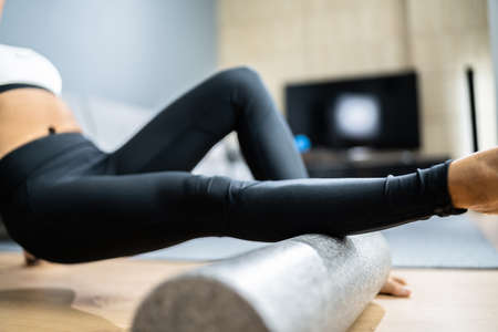 Foam Roller Healthy Leg Workout Sport Training On Floorの写真素材