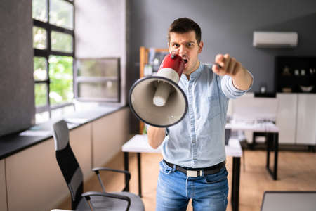 Angry Bully Boss Dominator Shouting In Business Meeting In Office