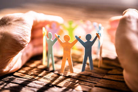 Inclusion And Diversity. Hand Protecting Inclusive Equal Persons