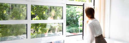 Fresh Air From Window. Side View Of Woman Breathing