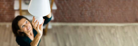 Electric LED Lightbulb Change In Light At Homeの写真素材