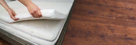 Mattress Topper Being Laid On Top Of The Bedの写真素材
