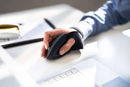 Vertical Ergonomic Optical Mouse For Carpal Tunnel Syndrome Preventionの写真素材
