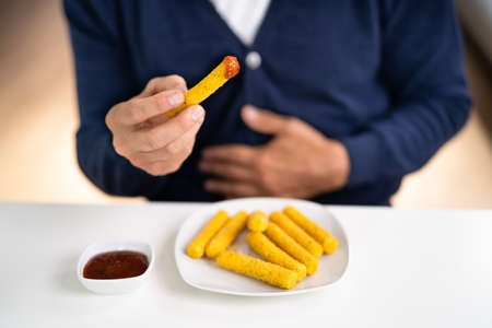 Heartburn Sick And Stomach Pain. Avoid Eating Fast Food.