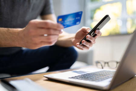 Online Shopping Payment On Mobile Phone Using Credit Cardの写真素材