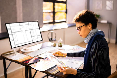 Real Estate Designer Working On Computer In Officeの写真素材