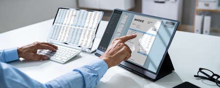 Business Invoice Tax Management. Accountant Using Monitor