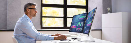 KPI Business Analytics Data Dashboard. Analyst Using Computer