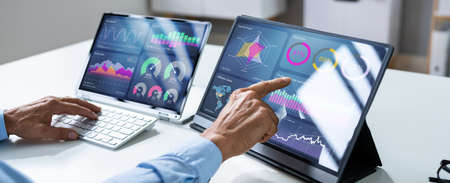 KPI Business Analytics Data Dashboard. Analyst Using Computer