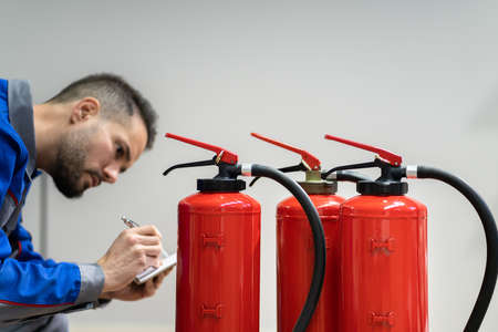 Fire Extinguisher Safety Prevention Check. Emergency Equipment Inspection