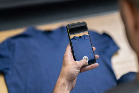 Online Business Using Smartphone. Photographing Fashion Clothesの写真素材