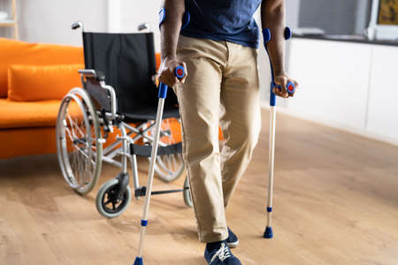 Man Using Crutches. Person After Accident With Leg Injuryの写真素材