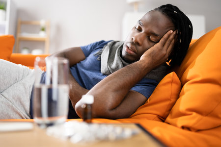Tired African American Man With Headache And Stressの写真素材