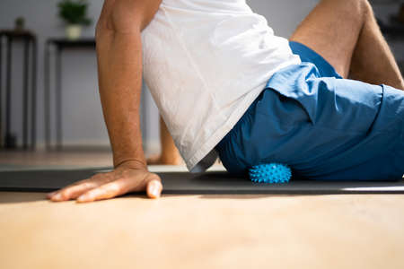 Glutes Trigger Point Massage Using Spiky Ball Myofascial Releaseの写真素材