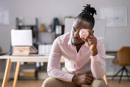 Saving Money And Financial Audit. Accountant With Piggybankの写真素材