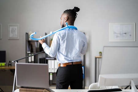 Man Using Muscle Hook For Trigger Point Massageの写真素材