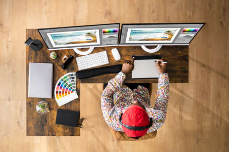 African Graphic Web Designer Using Design Editing Softwareの写真素材