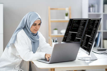 Programmer Woman Wearing Hijab Working. Coding Business Softwareの写真素材