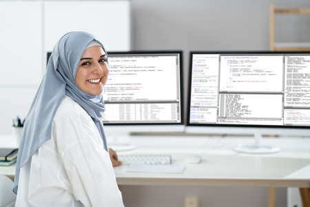 Programmer Woman Wearing Hijab Working. Coding Business Software