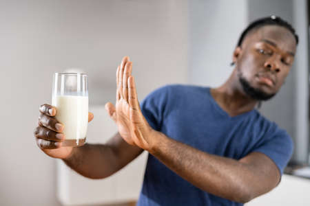 African Male Refusing Milk. Dairy Food Allergyの写真素材