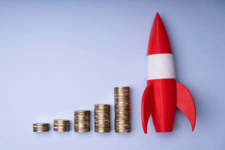 Rocket Upward Money Increase, Coin Stack Graphの写真素材