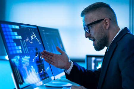 Sad And Shocked KPI Data Analyst Looking At Dashboard