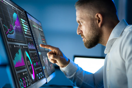 Business Analyst Working Late Using KPI Dashboard
