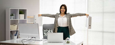Exercise Workout In Corporate Office With Documentsの写真素材