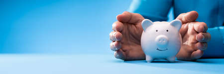 Pension And Income Protection. Save Money In Piggybank Insuranceの写真素材