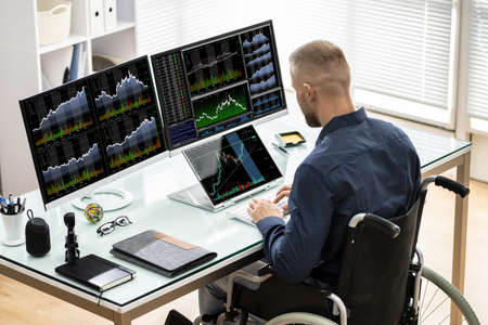 Man Trading Stock Market Exchange Online On Laptopの写真素材