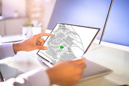 Cadastre Map And City Building Survey On Laptopの写真素材
