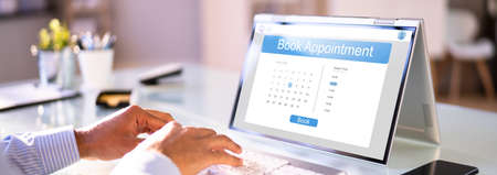 Booking Meeting Appointment On Laptop Computer Onlineの写真素材