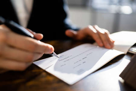 Writing Money Cheque. Sign Check Or Paycheck