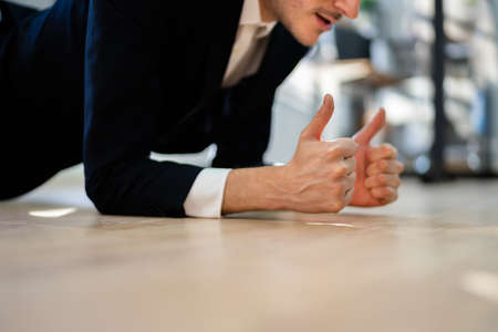 Man Doing Office Plank Exercise Workout Training