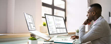 African American Programmer Man Coding On Computerの写真素材